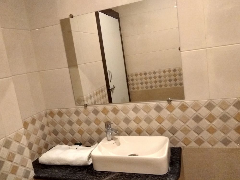 Capital O 75310 The Jk Hotel Deluxe Non AC room 5