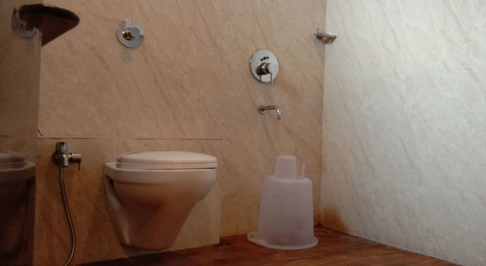 Capital O 75310 The Jk Hotel Deluxe Non AC room 6