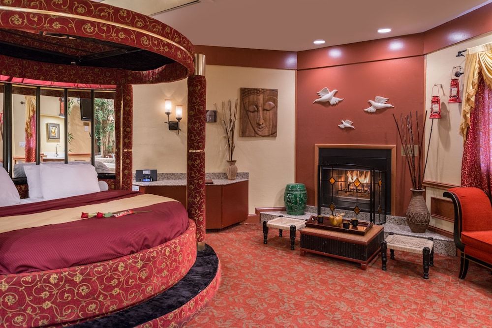 Asian Theme Suite with Round Bed, Jetted Tub & Fireplace