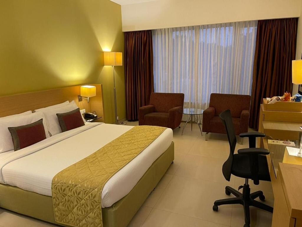 Radha Regent Electronic City Premium Pool View Room