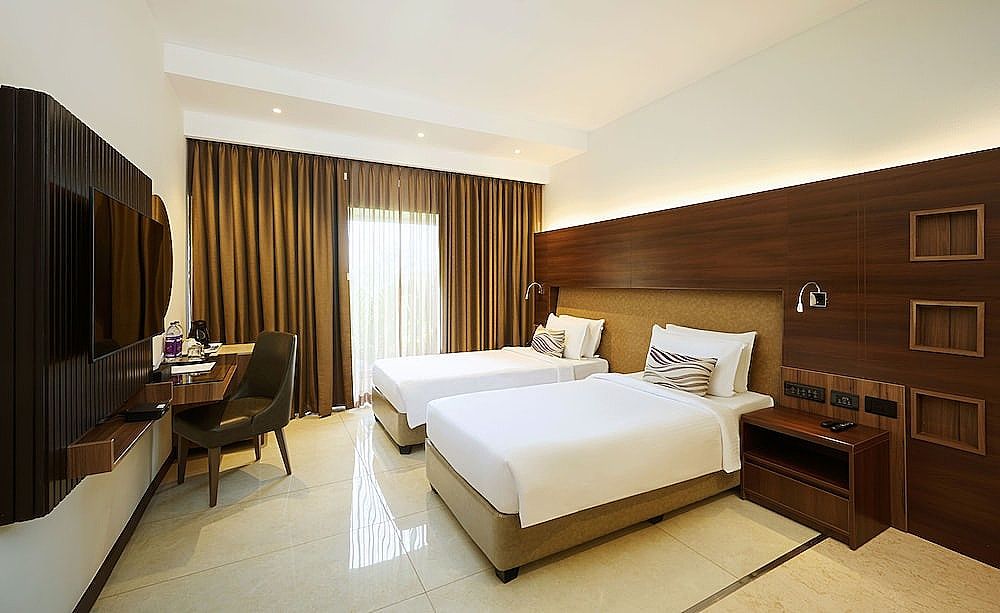 Flora Airport Hotel and Convention Centre Kochi Deluxe twin room with complimentary airport transfers 3
