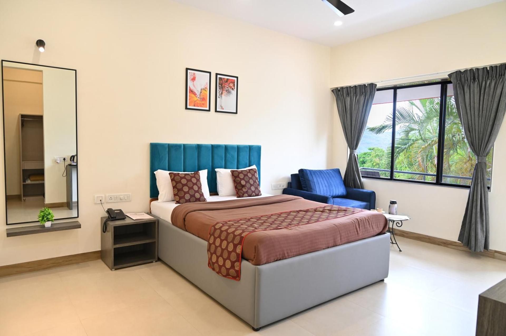 Girivihar Dining & Holiday Club Deluxe Room