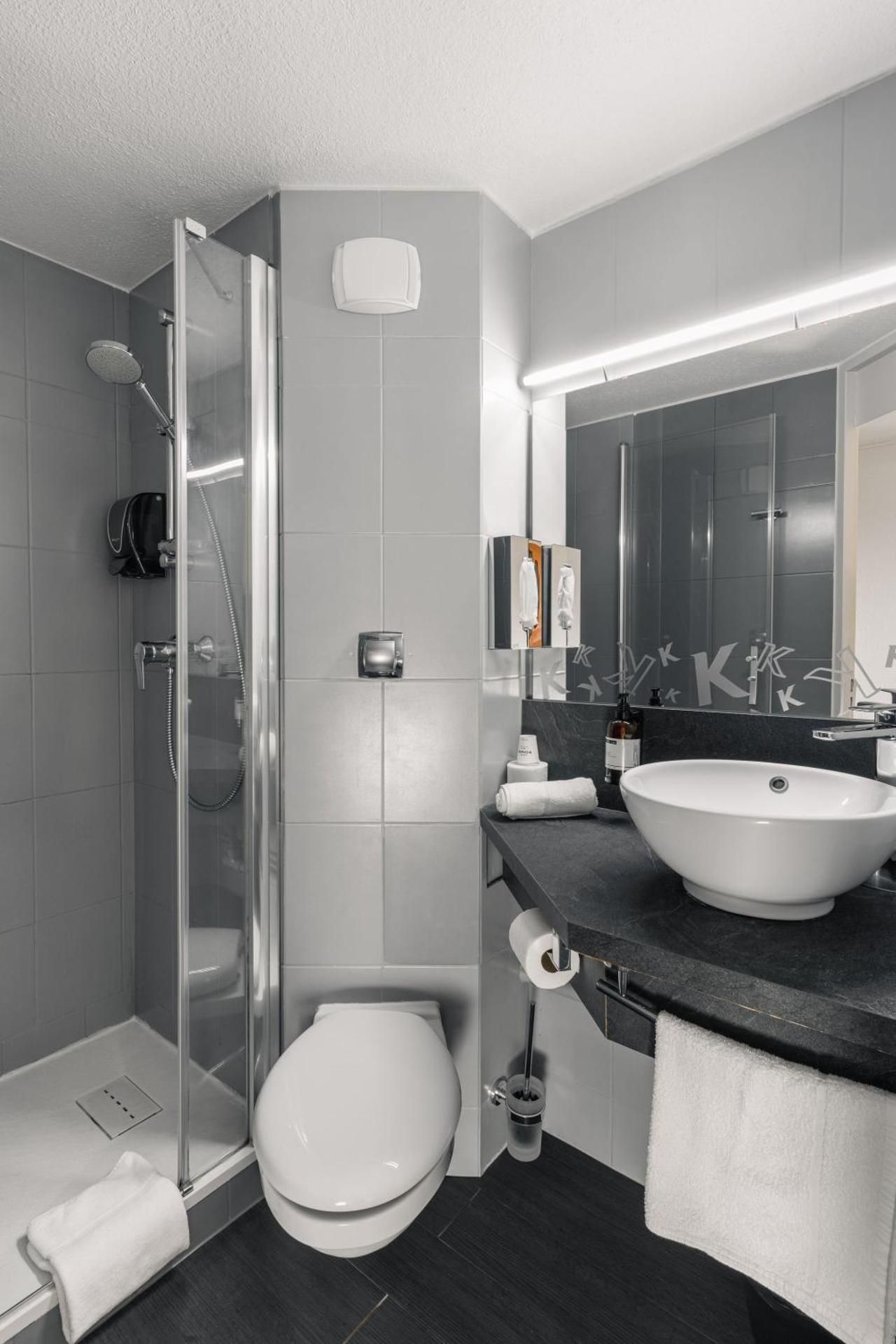 Kyriad Saint Brieuc Quadruple Room with One Double Bed and Two Single Beds 3