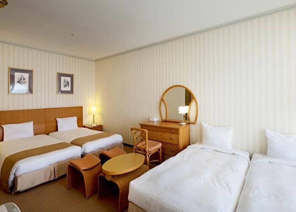 Balcony Quadruple Room (2 single + 2 extra beds), Non Smoking