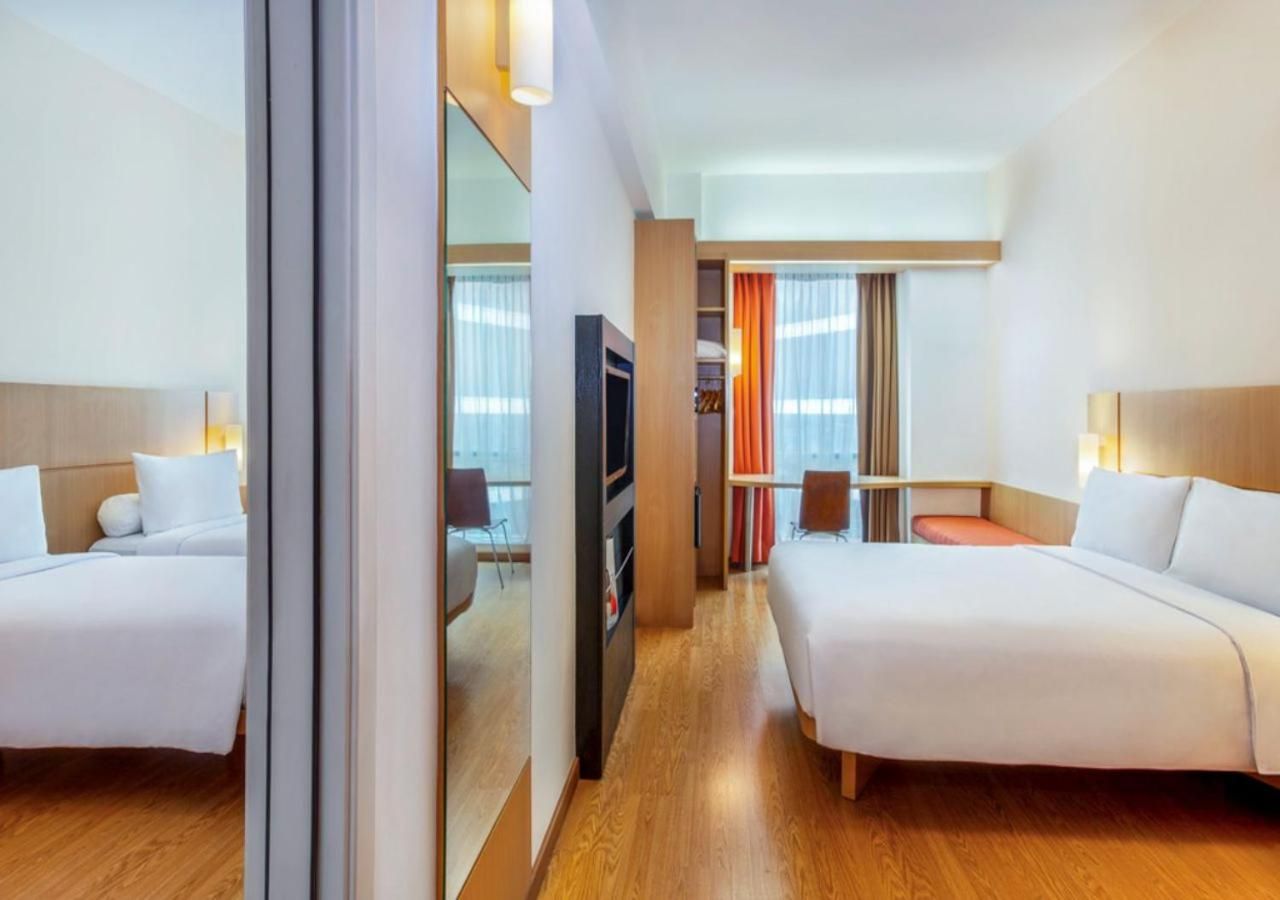 Family Room with Queen Bed and Two Single Beds