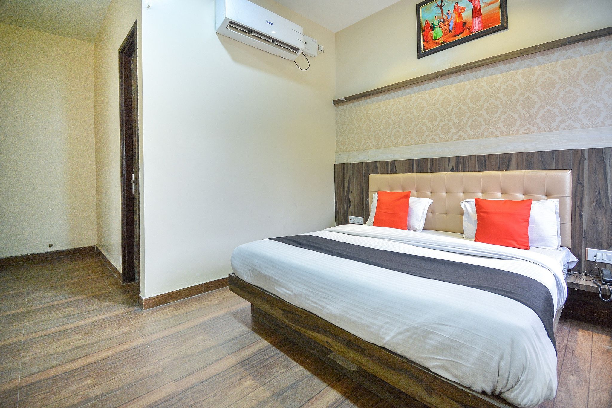 Capital O Moments Inn Deluxe Room