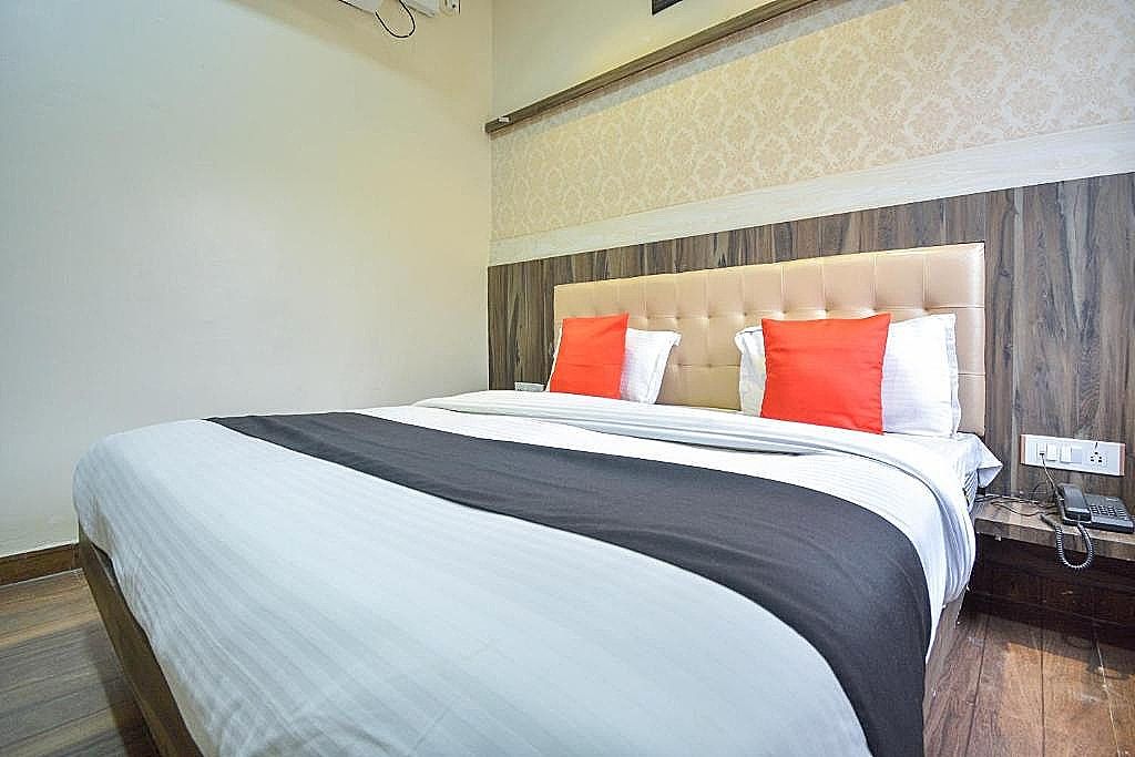 Capital O Moments Inn Deluxe Room 2