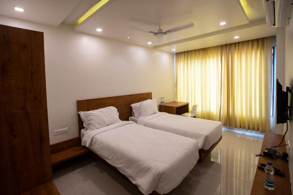 The Orange Flag Renuka Hotel  Classic Twin Room 3