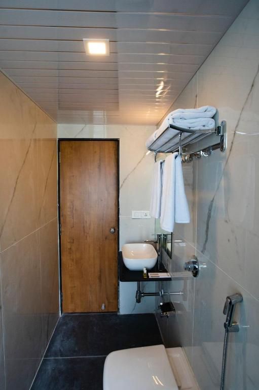 The Orange Flag Renuka Hotel  Classic Twin Room 7