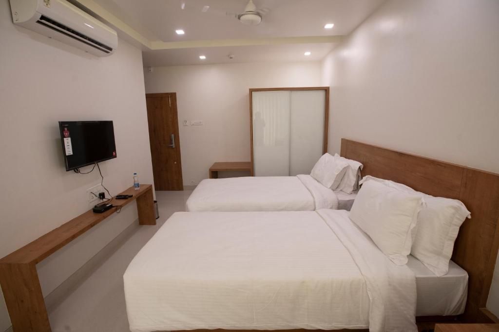 The Orange Flag Renuka Hotel  Classic Twin Room 4