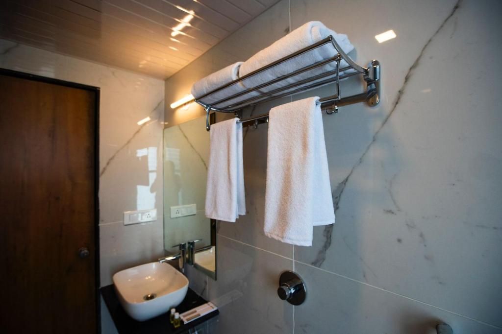 The Orange Flag Renuka Hotel  Classic Twin Room 8