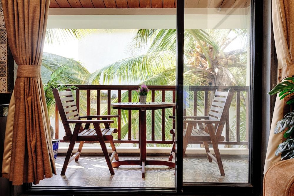 Riva Boutique Apartments Premium room with living area and balcony 6