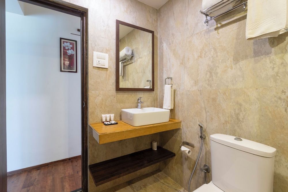 Riva Boutique Apartments Premium room with living area and balcony 9