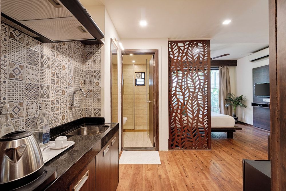 Riva Boutique Apartments Premium room with living area and balcony 7