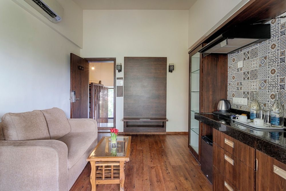 Riva Boutique Apartments Premium room with living area and balcony 11