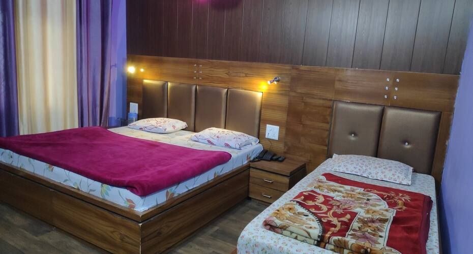 Hotel Brahma Kamal Deluxe Three Bed 2