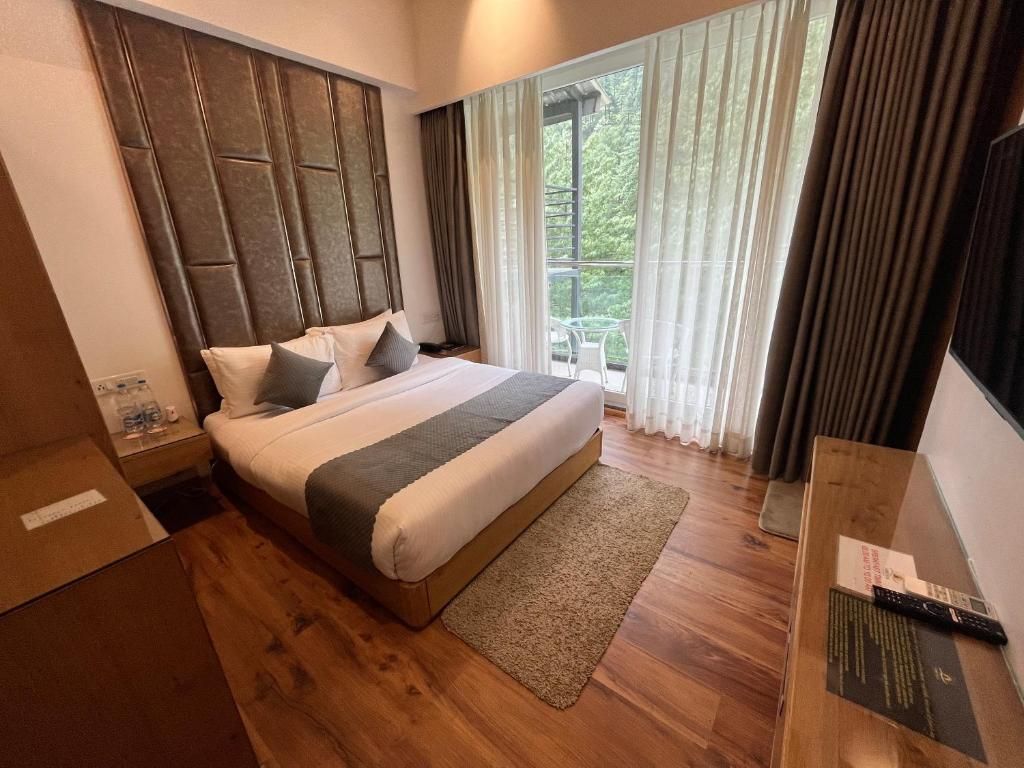 Moksha Riverside Resort Deluxe River Facing with Balcony 6
