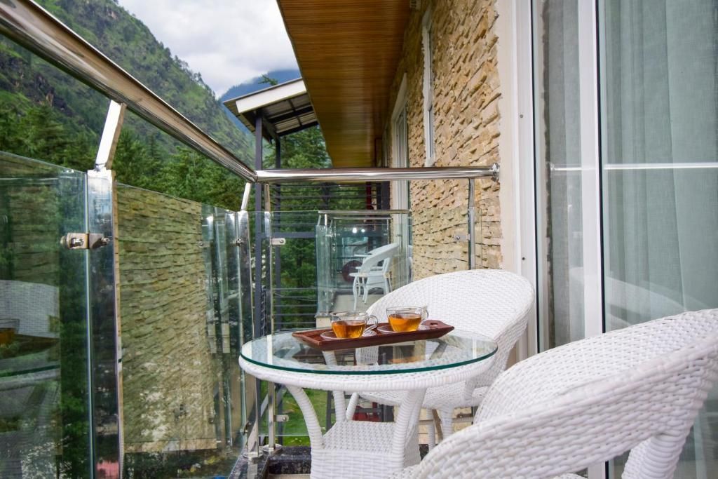 Moksha Riverside Resort Deluxe River Facing with Balcony 13