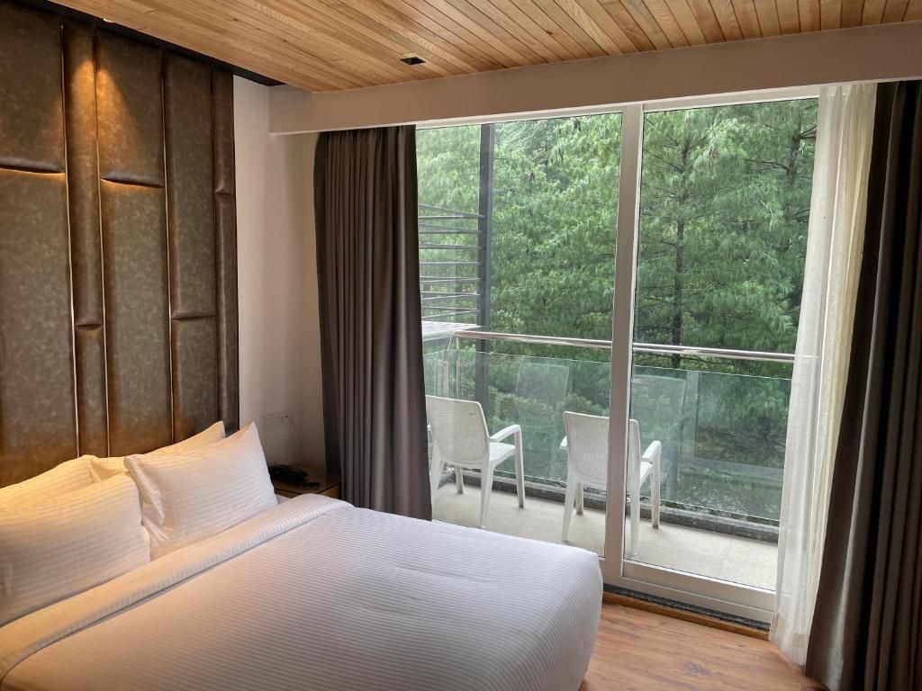 Moksha Riverside Resort Deluxe River Facing with Balcony 10