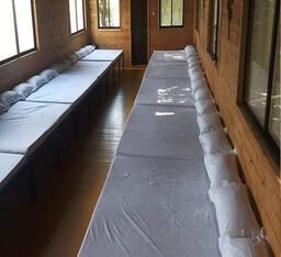 Non-A/c wooden dormitory.