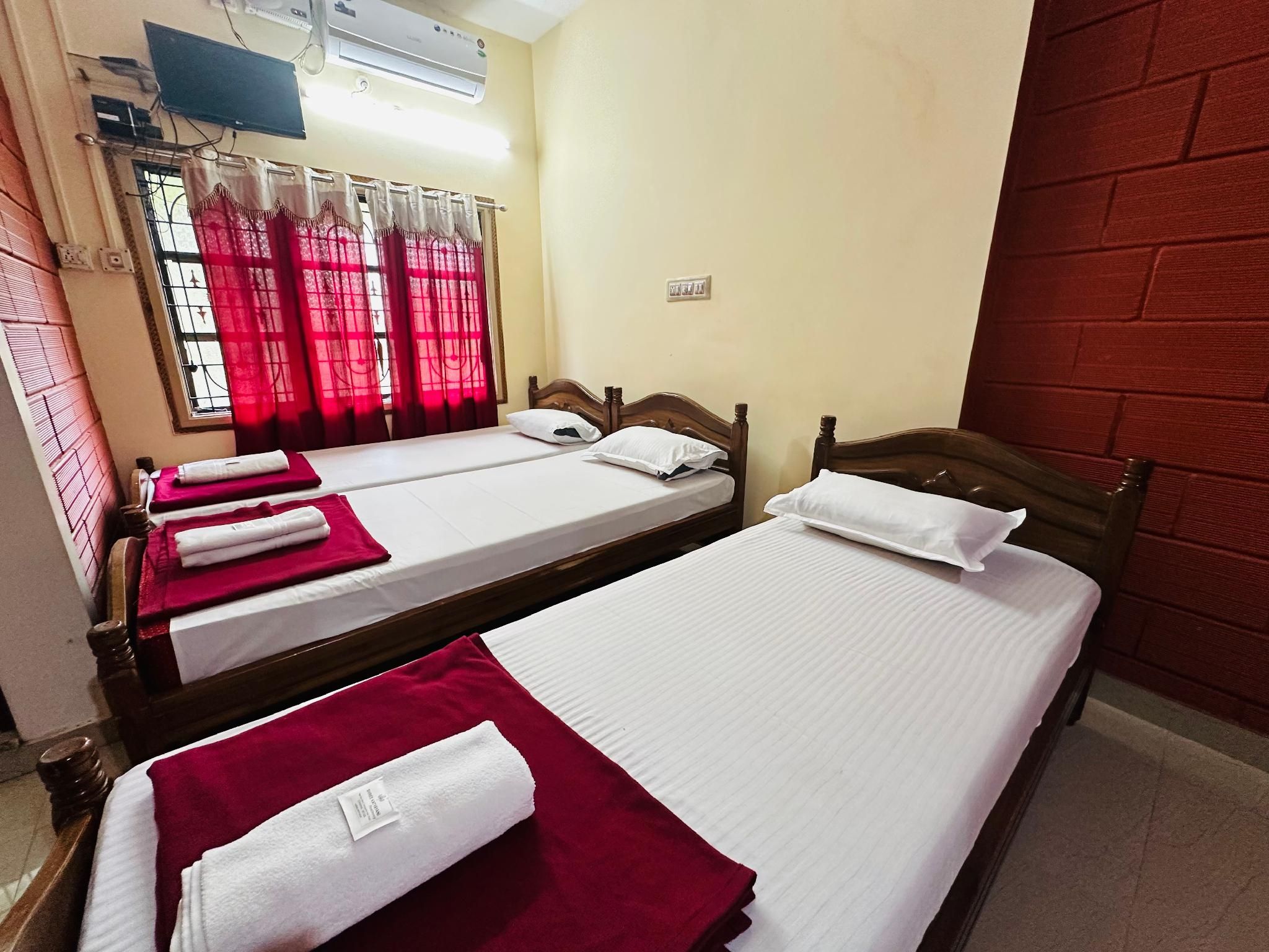Triple Bed Room With Air Conditioning