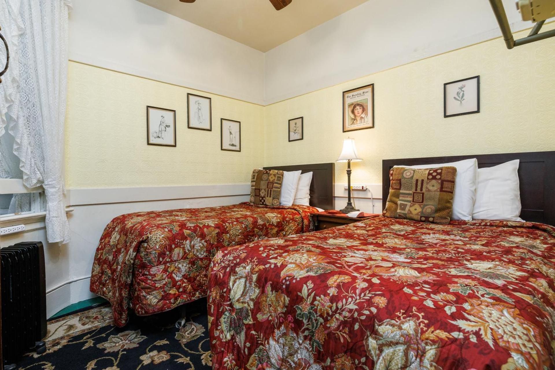 Two Twin Sized Beds with Shared Bathroom