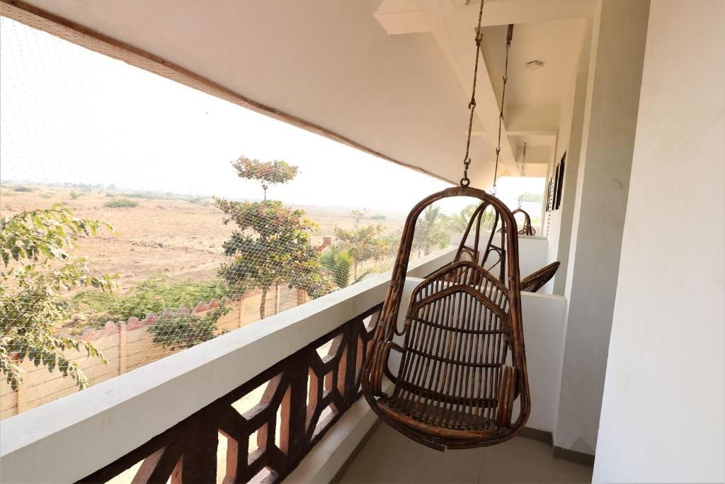 Goverdhan Greens Resort Deluxe Room with Balcony 4