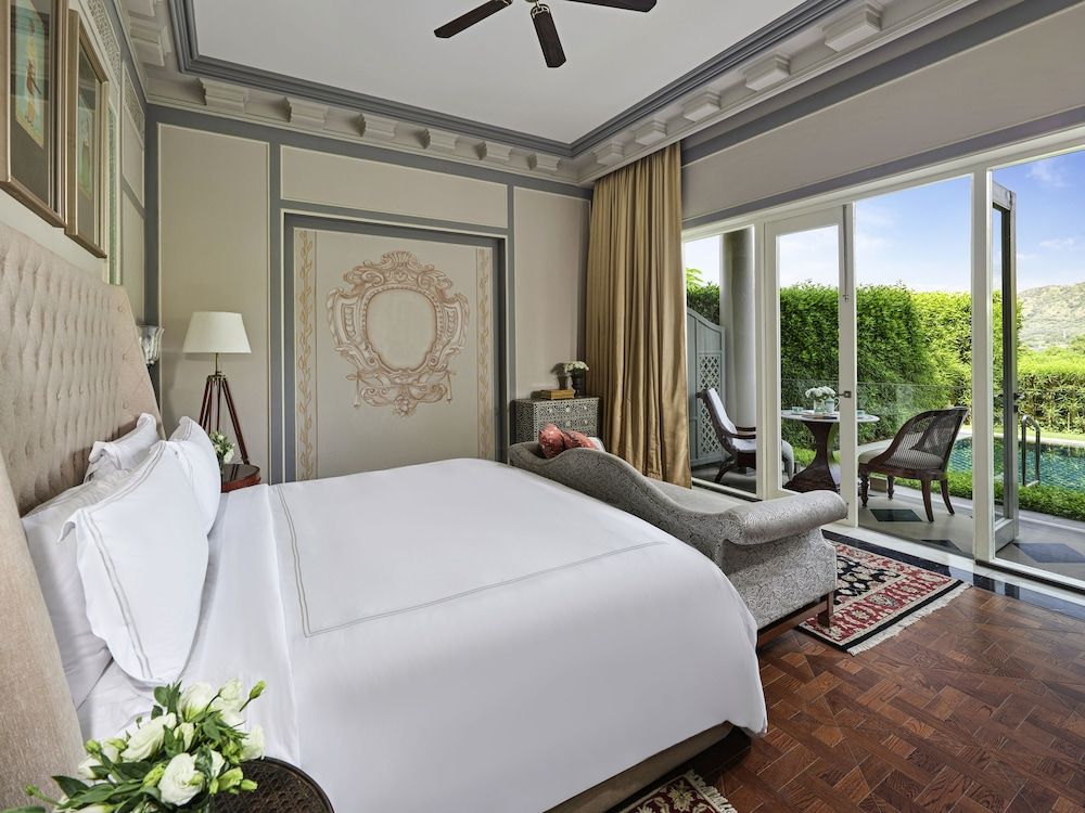 Raffles Udaipur Lakeshore Signature Room- 60 sqm retreat on lake shore with views, tub, rain shower, and decor
