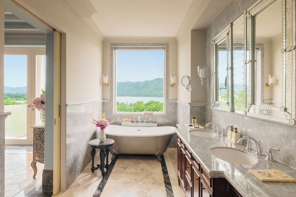 Raffles Udaipur Lakeshore Signature Room- 60 sqm retreat on lake shore with views, tub, rain shower, and decor 5