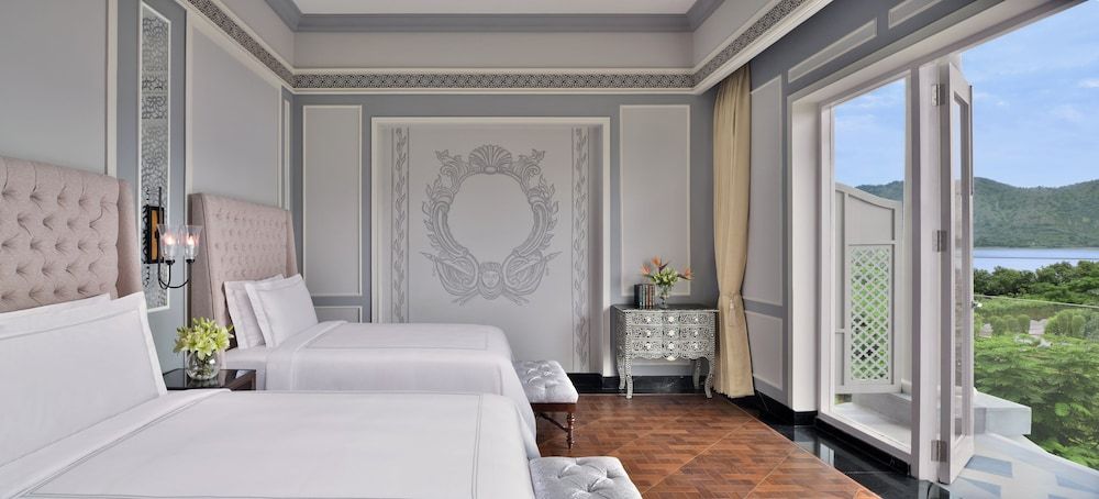 Raffles Udaipur Lakeshore Signature Room- 60 sqm retreat on lake shore with views, tub, rain shower, and decor 2