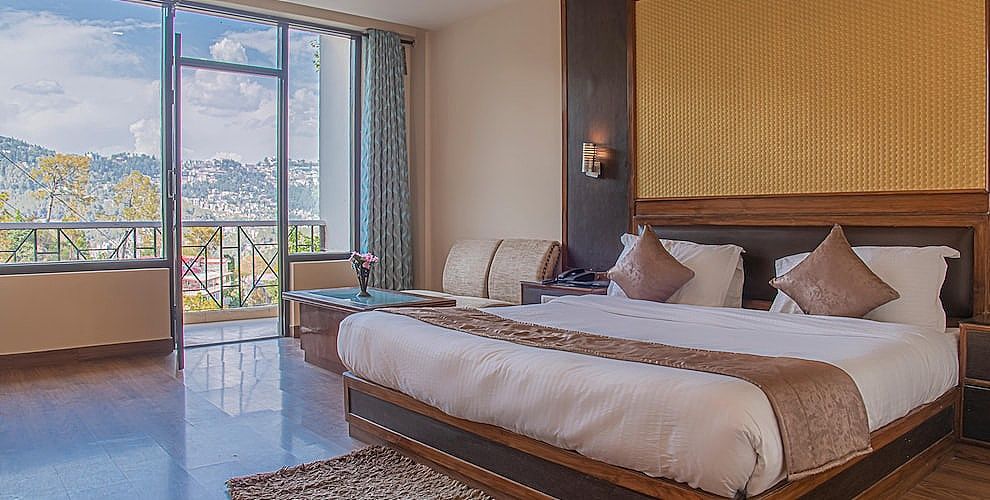 Sukhsagar Regency | Indoor heated pool Deluxe Room AC/Heating 4