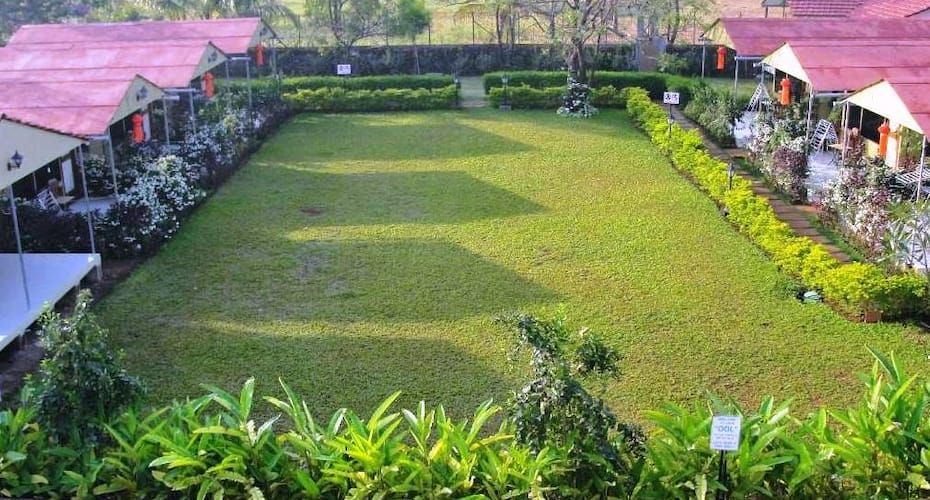 Nirmal Cottages (Pure Veg) garden 2