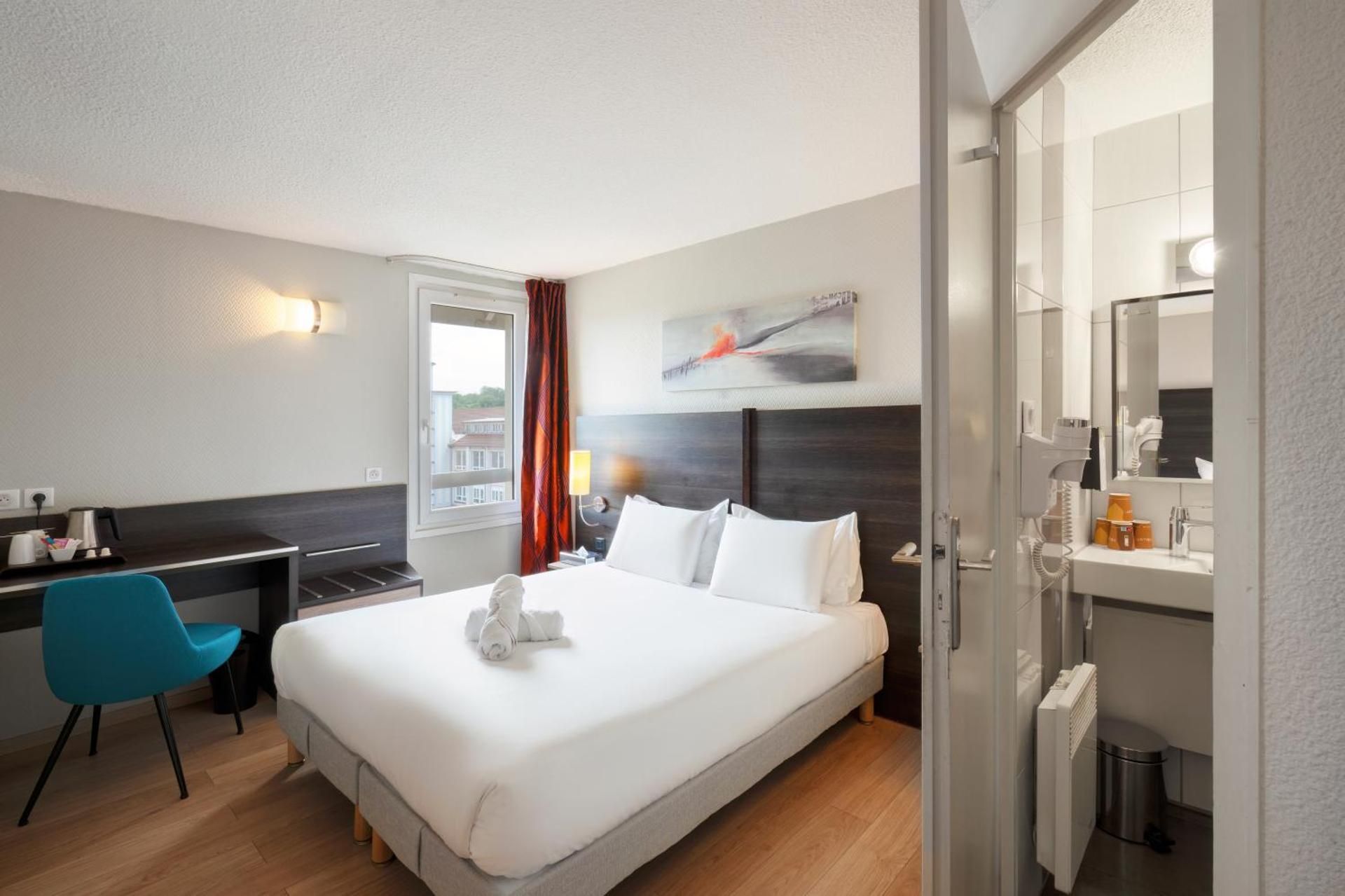 Kyriad Belfort Hotel Quadruple Room with One Double Bed and  Two Single Beds