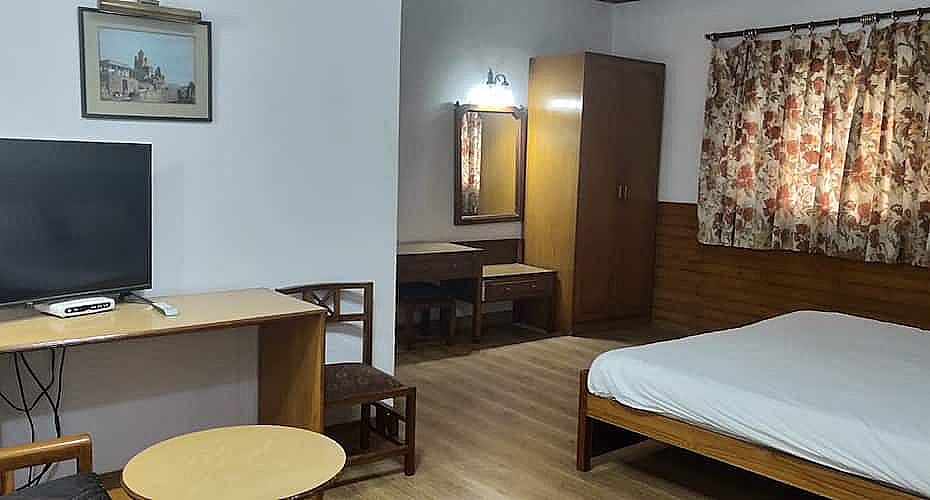 These rooms have European decor, spacious room with sitting area with excellent view of town.The rooms have attached bathrooms with geyser.