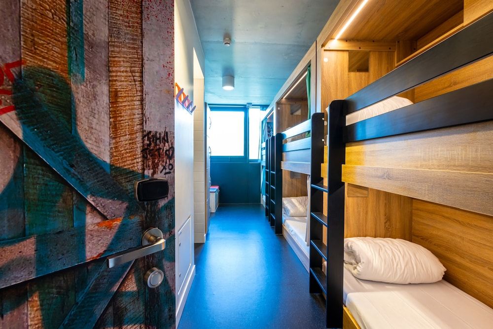 Bed in dormitory of 6 with shared bathroom