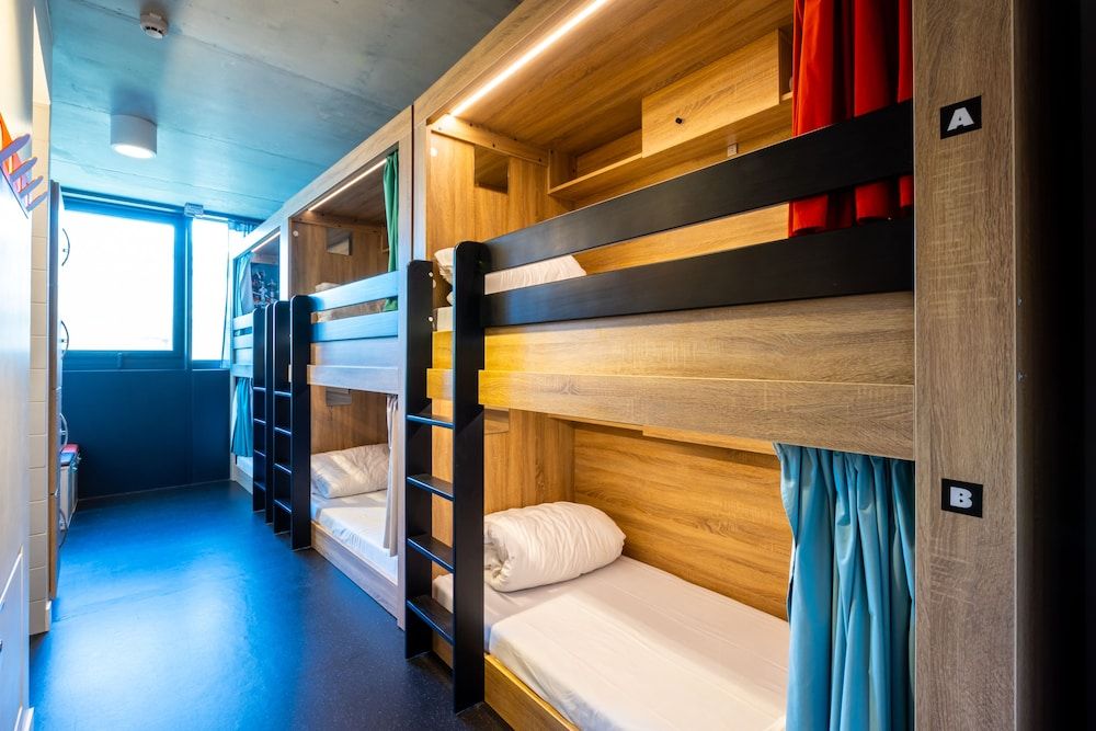 Bed in dormitory of 6 with shared bathroom
