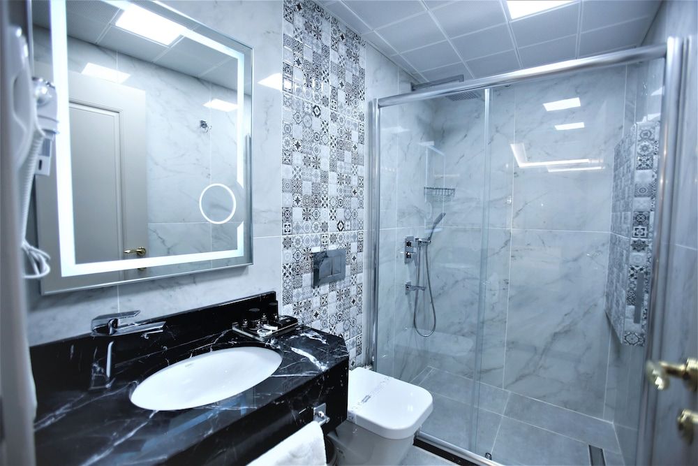 Omma Hotel Deluxe Triple Room 5