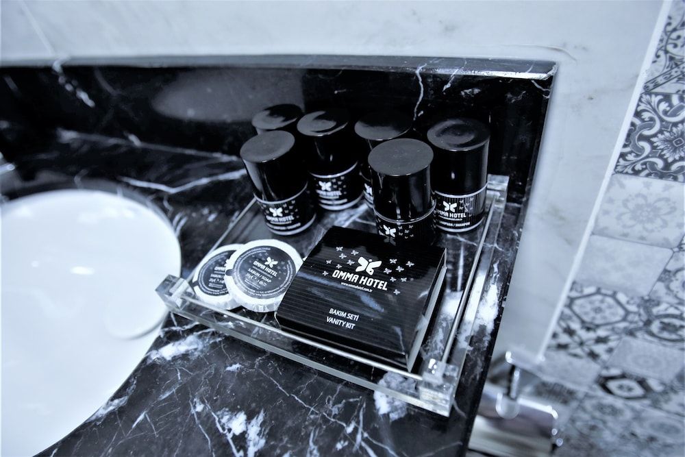 Omma Hotel Deluxe Triple Room 4