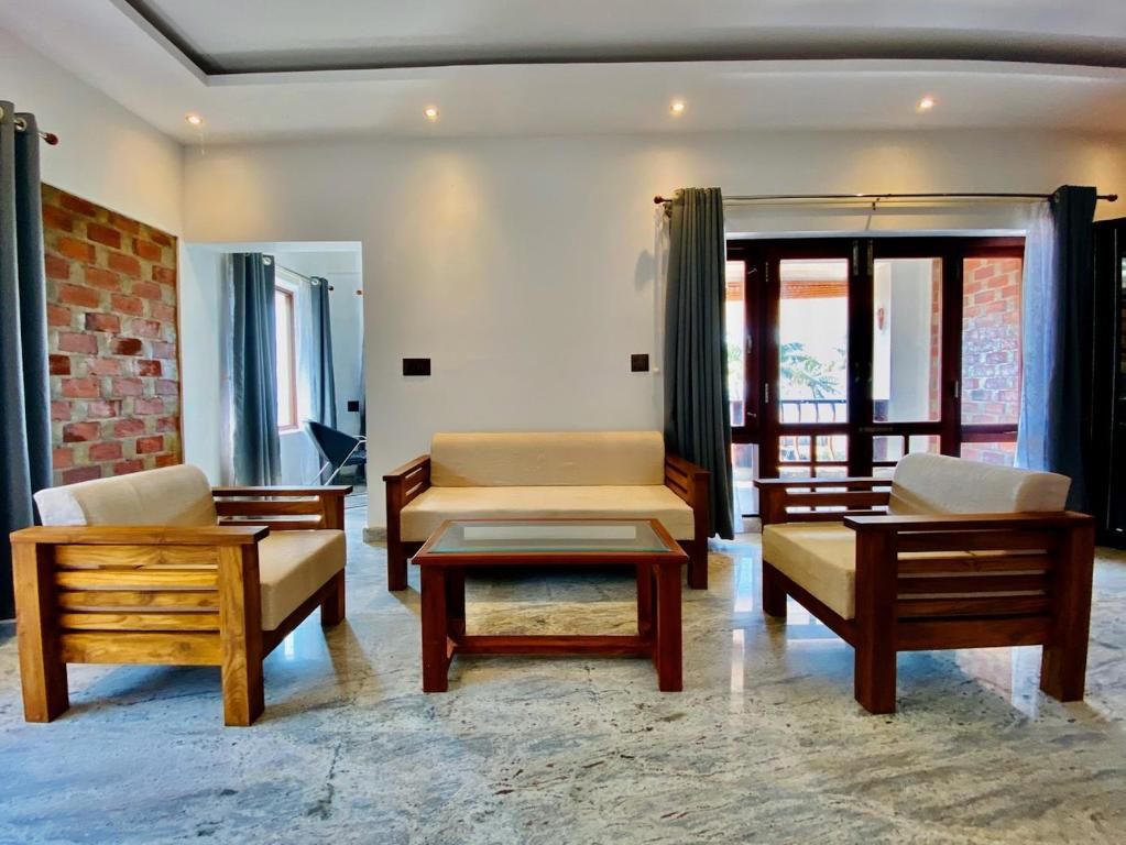Ashokam Resorts AC deluxe double room with garden view 6
