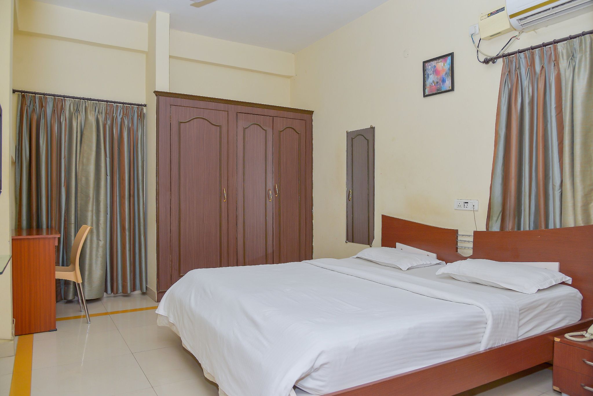 Maven Suites Standard A/C Room