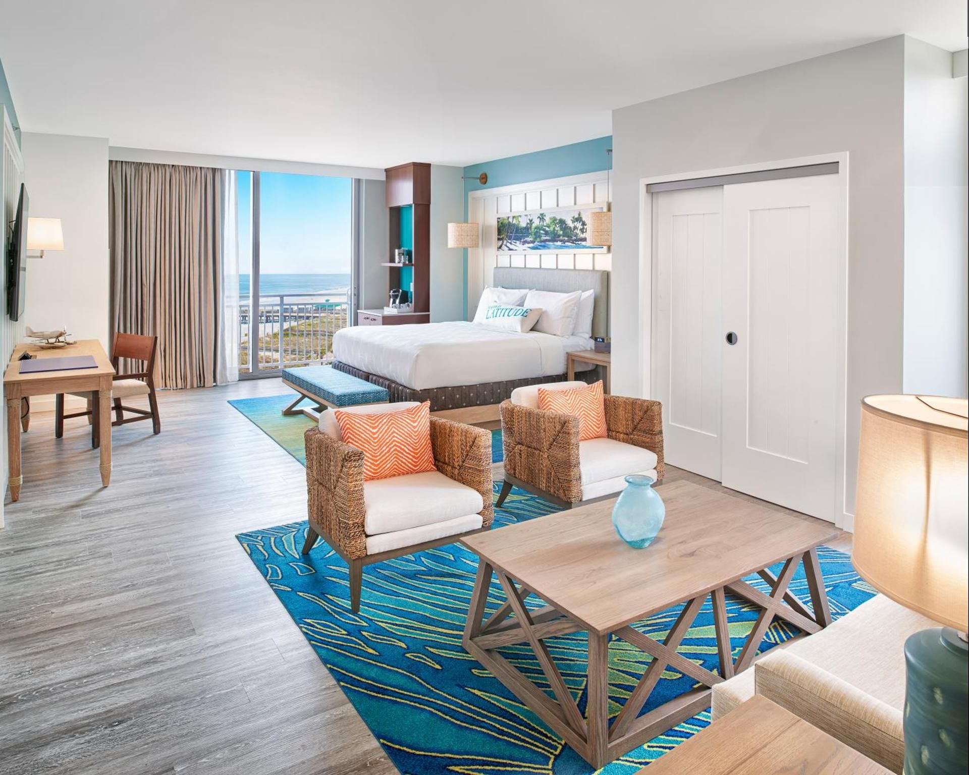 Premium Room 1 king bed corner with sofa Partial Ocean View