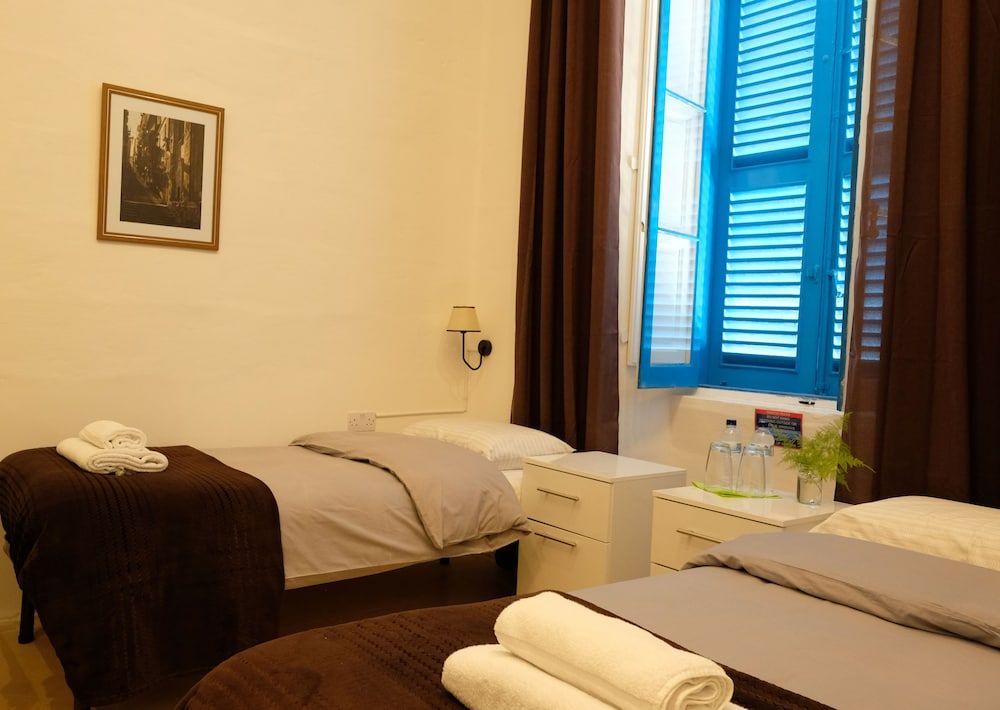The Maltese Sun Quadruple Room 7
