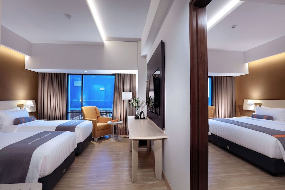 Harper Palembang by ASTON Deluxe Room 2