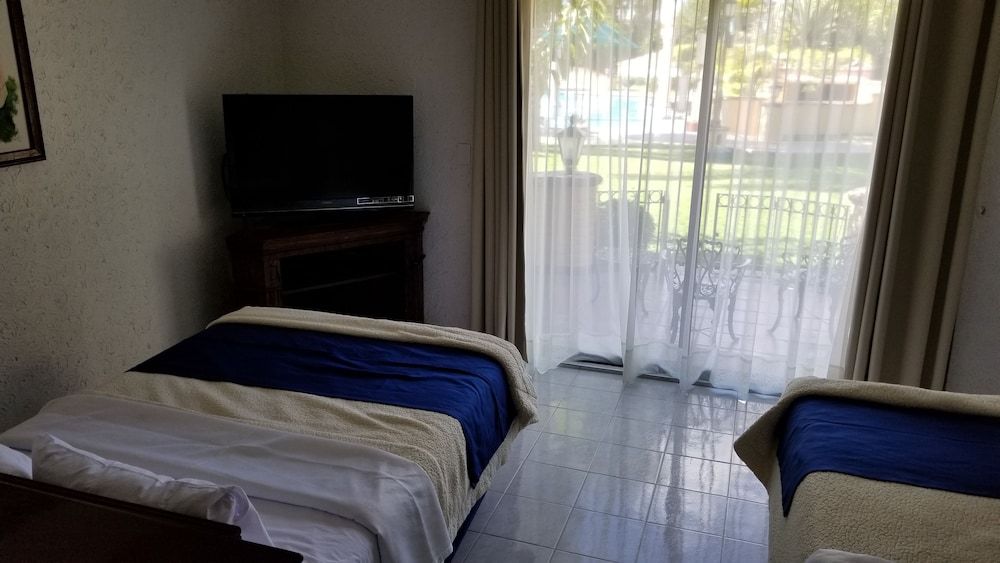 Standard Quadruple Room, 2 Double Beds, Garden View