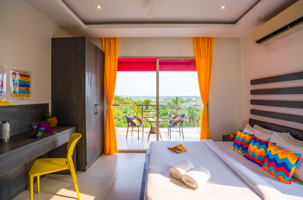 goSTOPS Goa Baga Deluxe Private A/C Room with Balcony and Ensuite Bathroom 6