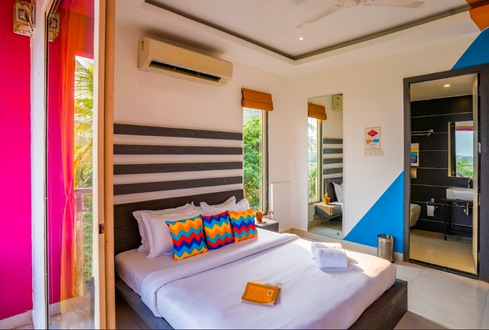 goSTOPS Goa Baga Deluxe Private A/C Room with Balcony and Ensuite Bathroom 2