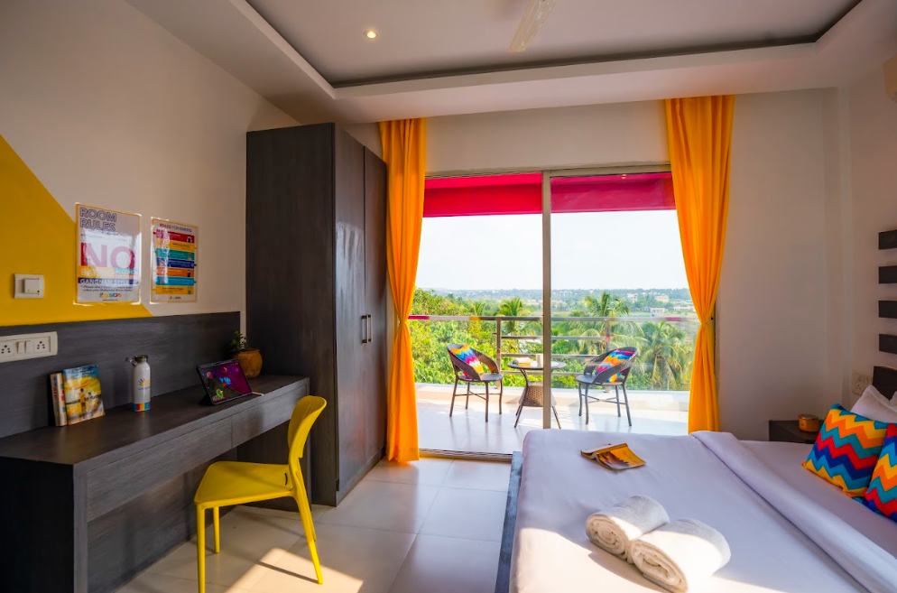 goSTOPS Goa Baga Deluxe Private A/C Room with Balcony and Ensuite Bathroom 9