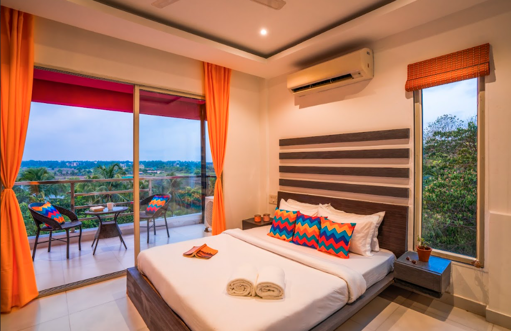 goSTOPS Goa Baga Deluxe Private A/C Room with Balcony and Ensuite Bathroom 4