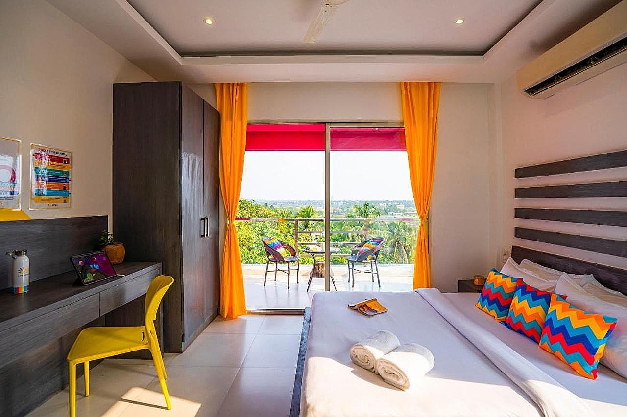 goSTOPS Goa Baga Deluxe Double AC Room with Balcony, Ensuite Bathroom 2