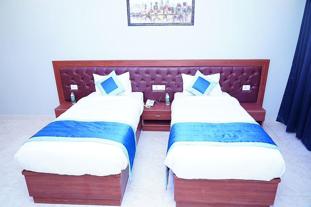 Expo Mart Inn Twin Bed Room